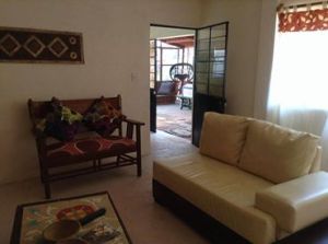 The Guest House - set at the edge of our organic garden, this cottage is a perfect retreat for a solo traveler seeking a longterm getaway or for a small group.